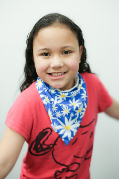 small waterproof bandana bib on smiley girl