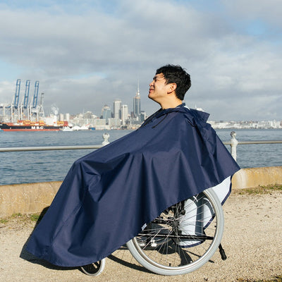 Man wearing Wheelchair Rain Coat outdoor side