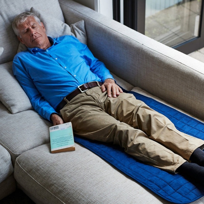 elderly man Waterproof Seat Protector on the couch