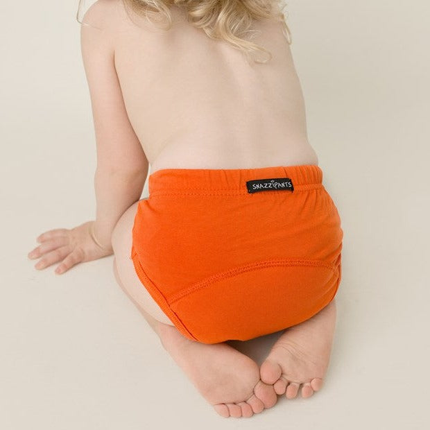 Toddler wear orange training pants